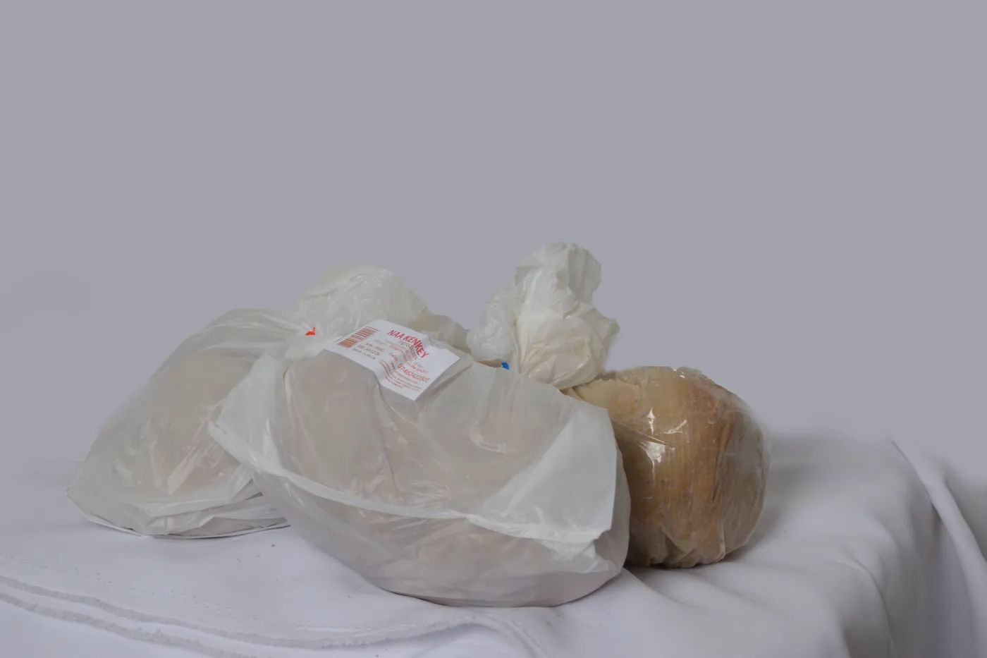 Naa Kenkey balls in maize husk